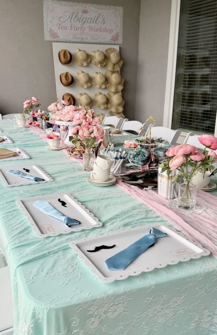 Tea party table with floral decorations.