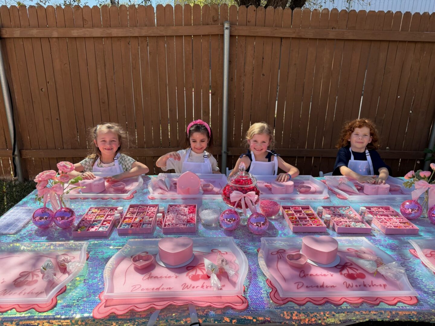 Children at a colorful outdoor tea party.