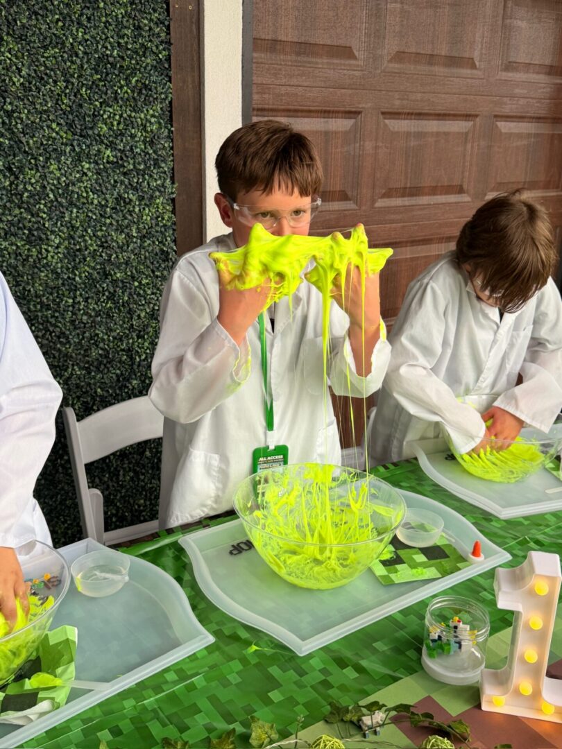 Children playing with bright yellow slime.