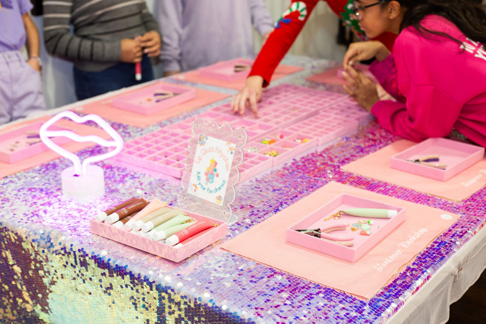 Children crafting at a colorful table.