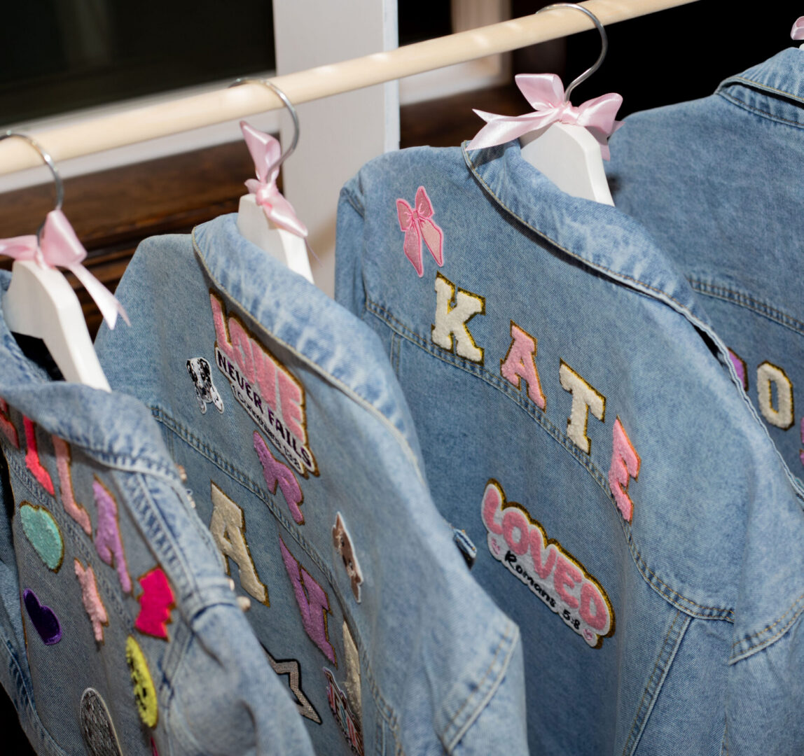 Personalized denim jackets with colorful patches.