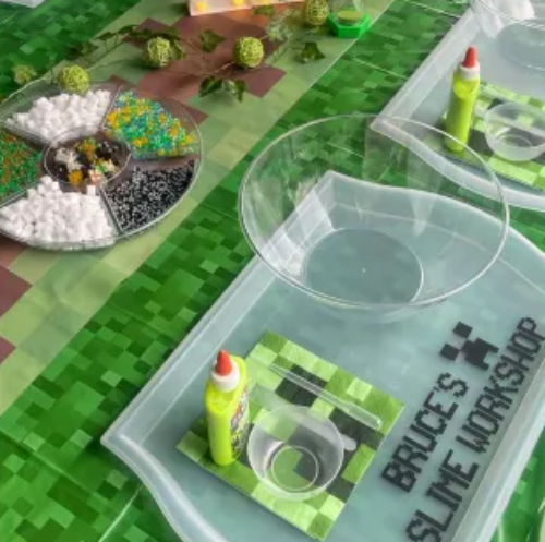 Slime workshop setup with bowls and supplies.