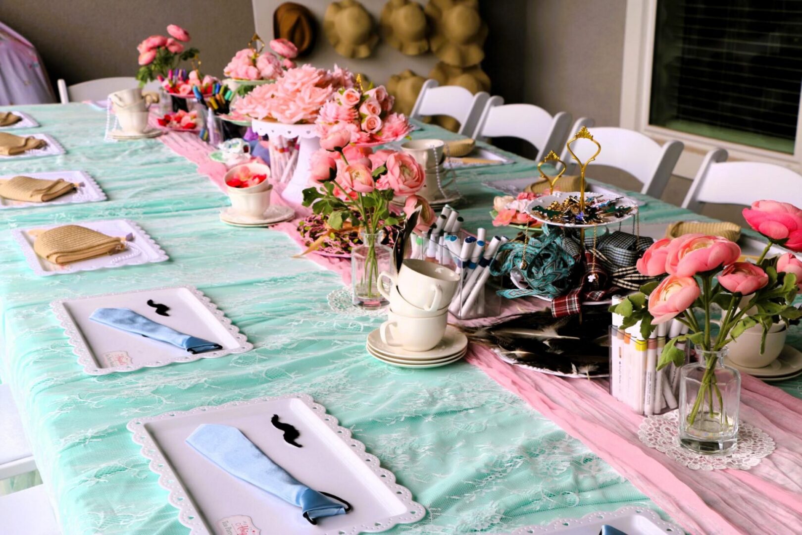 Elegant table setting with pink flowers.