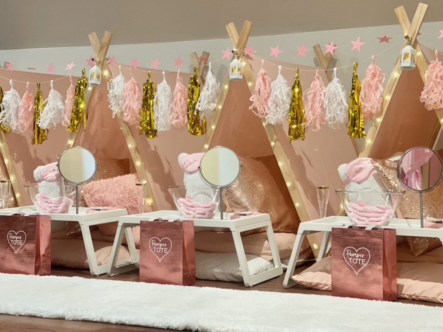 Pink sleepover tents with mirrors and decorations.