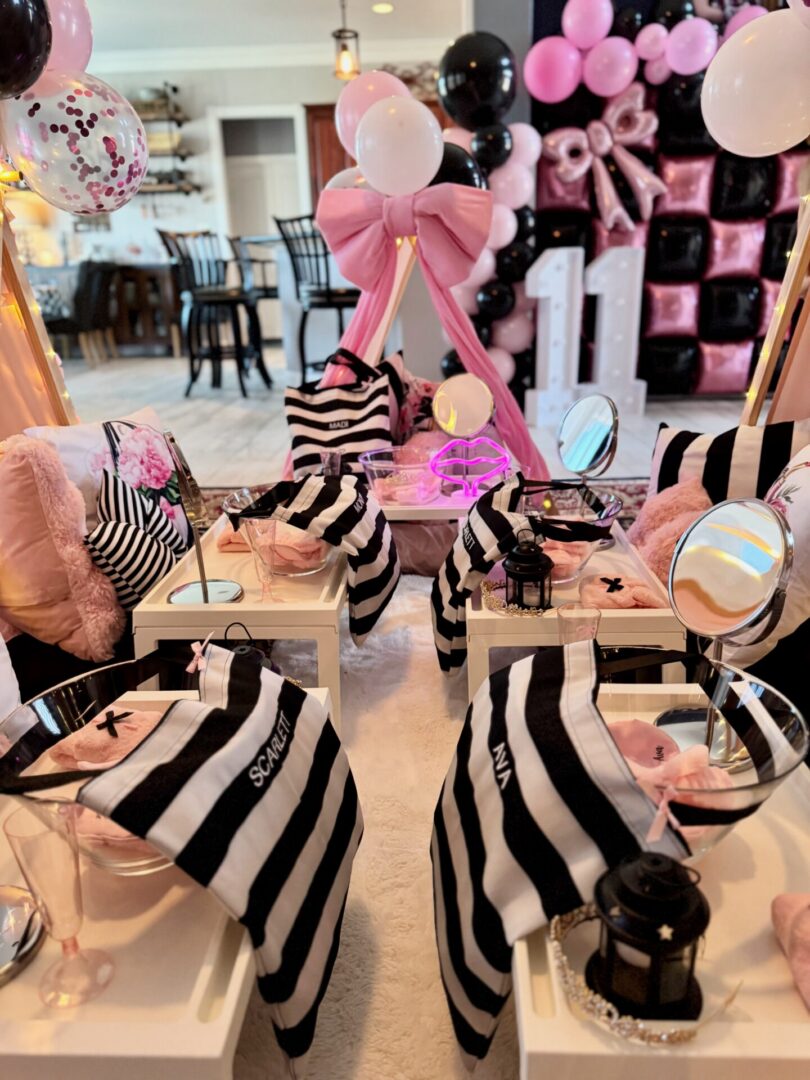 Sleepover setup with pink and black decorations.