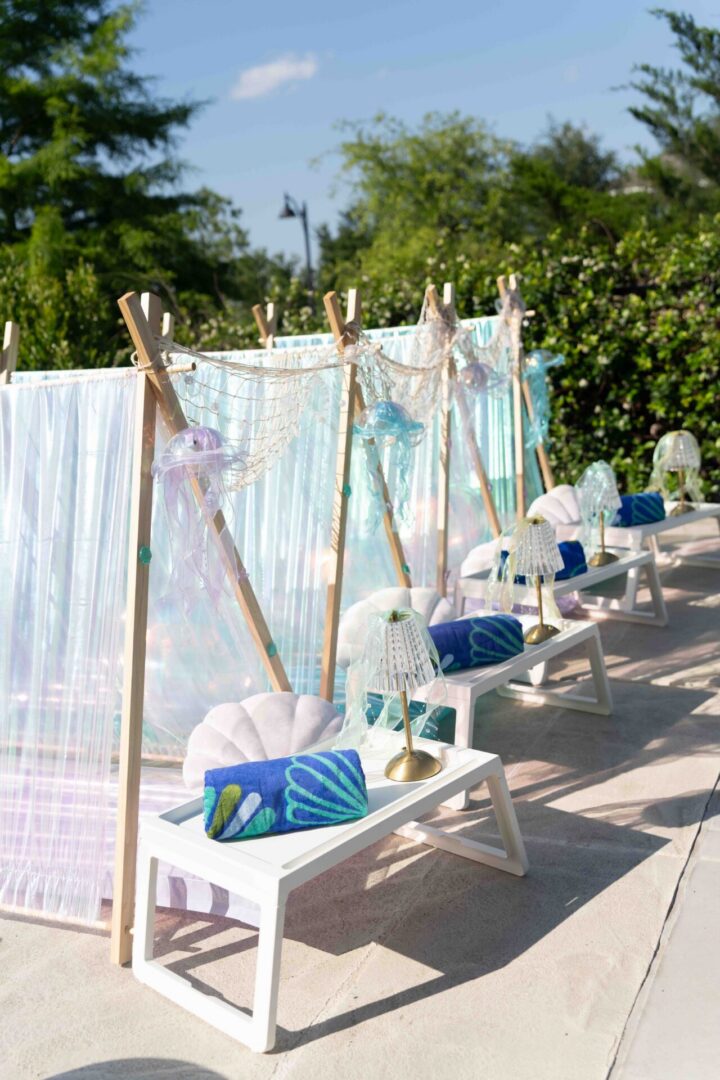Outdoor seating with decorative pillows and lamps.