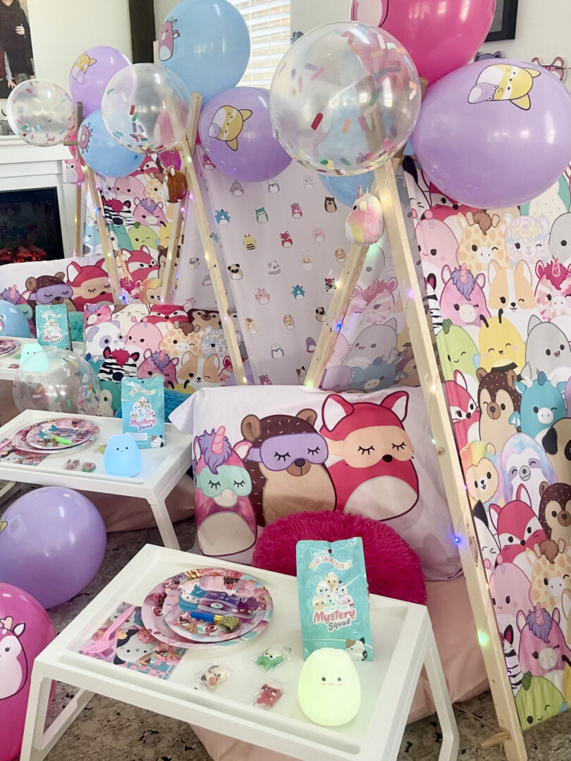 Colorful slumber party setup with balloons.