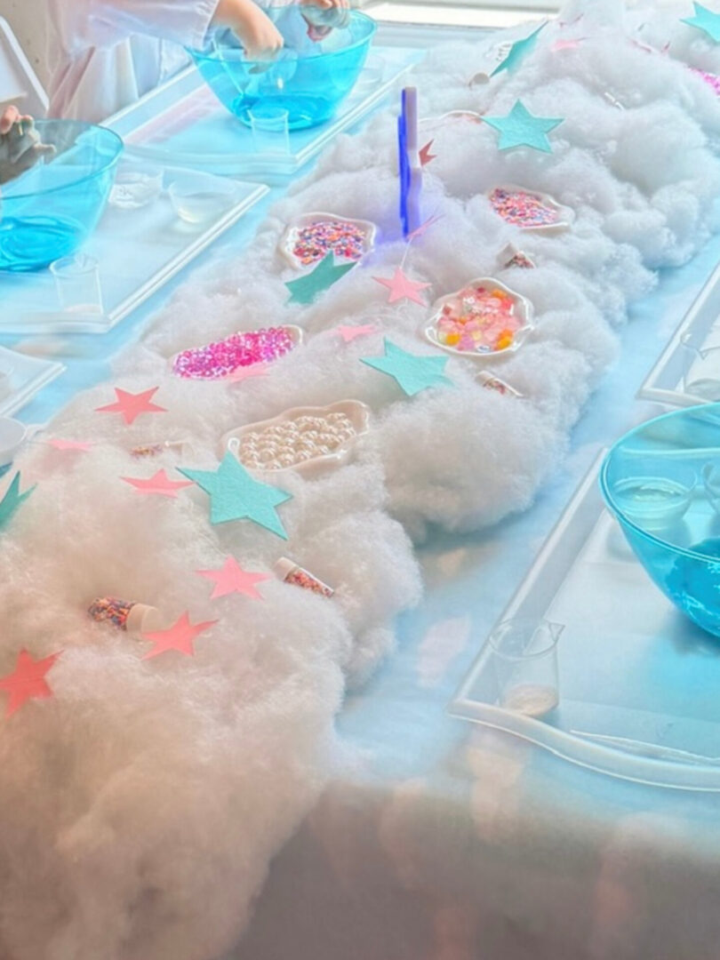 Colorful table setup with fluffy decorations.