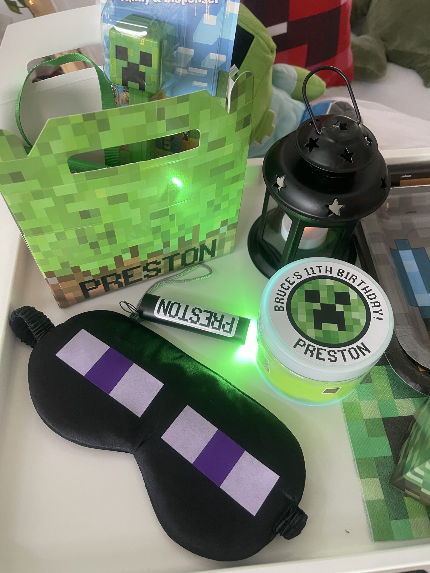 Minecraft-themed birthday party favors on table.