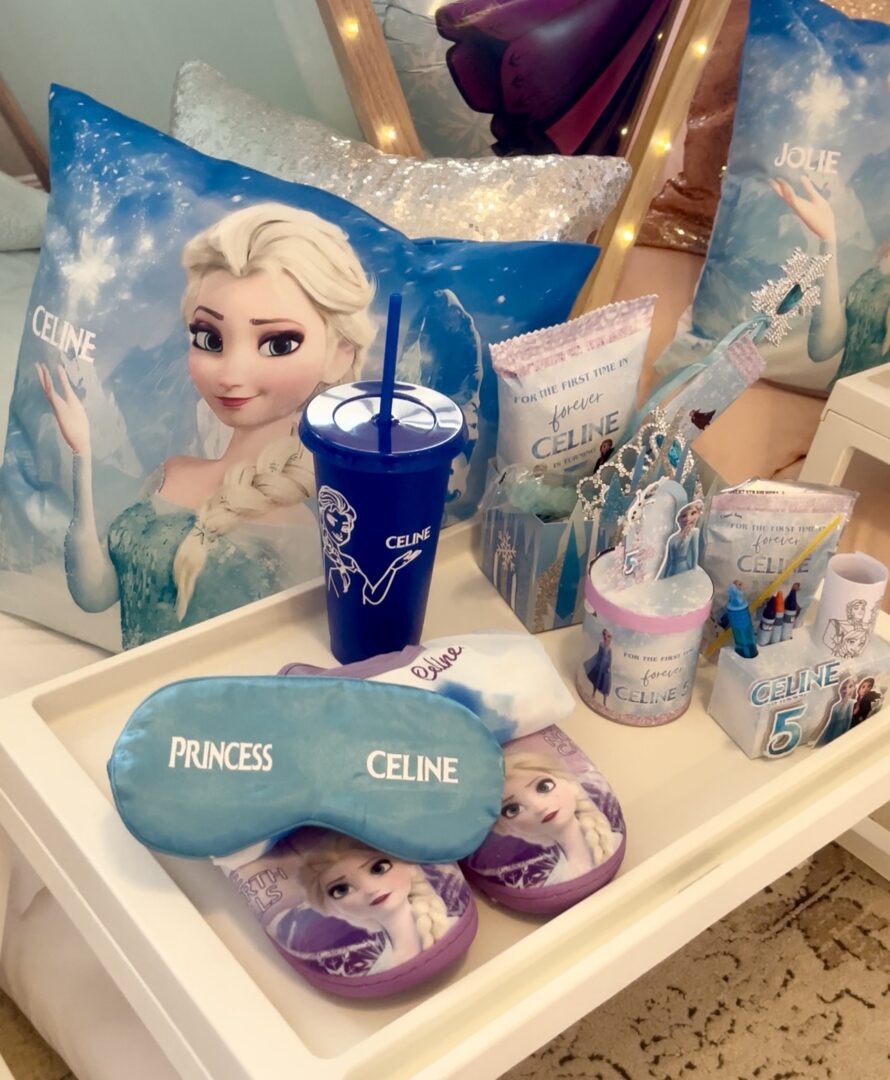 Frozen-themed party favors and decorations display.