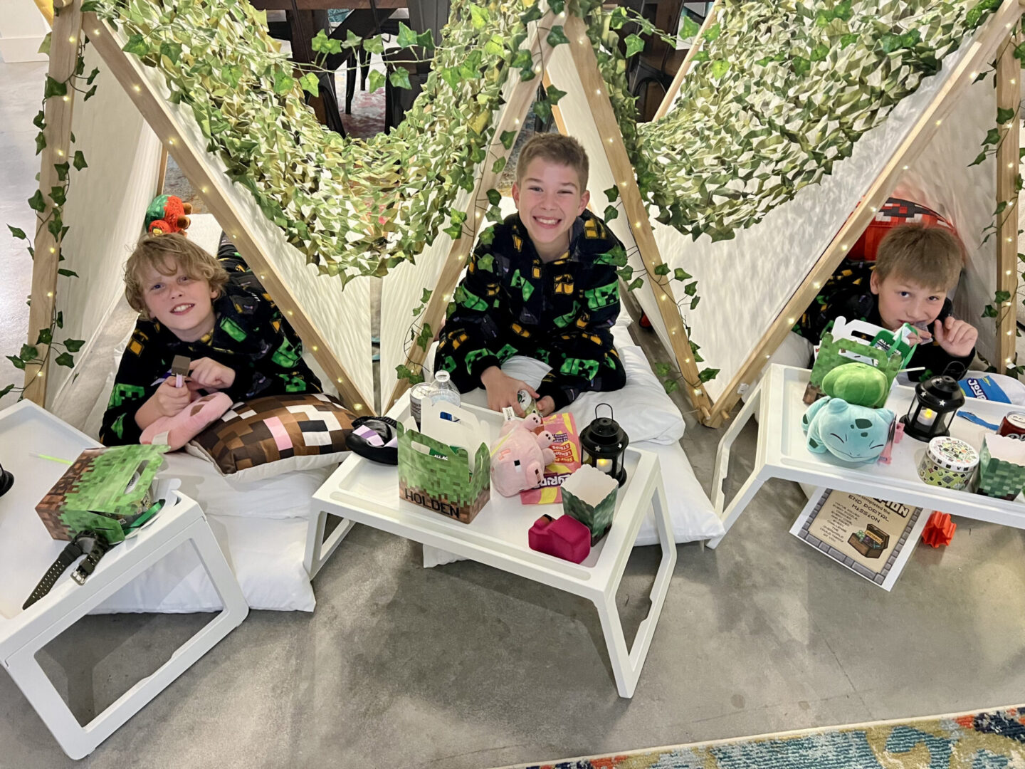 Kids in pajamas with indoor tents.