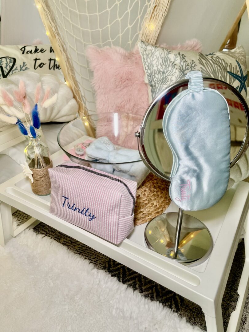 Cozy vanity setup with pillows and accessories.