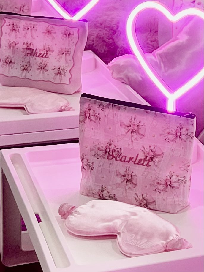 Pink floral pouches with neon heart lights.